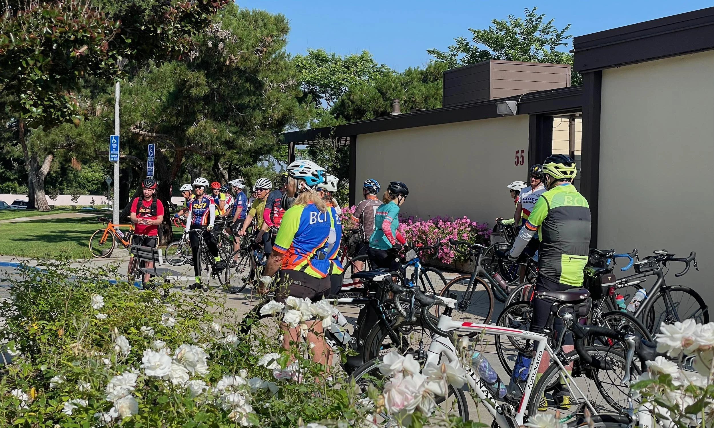 Riders gathering at Deerfield Community Park before a Saturday ride